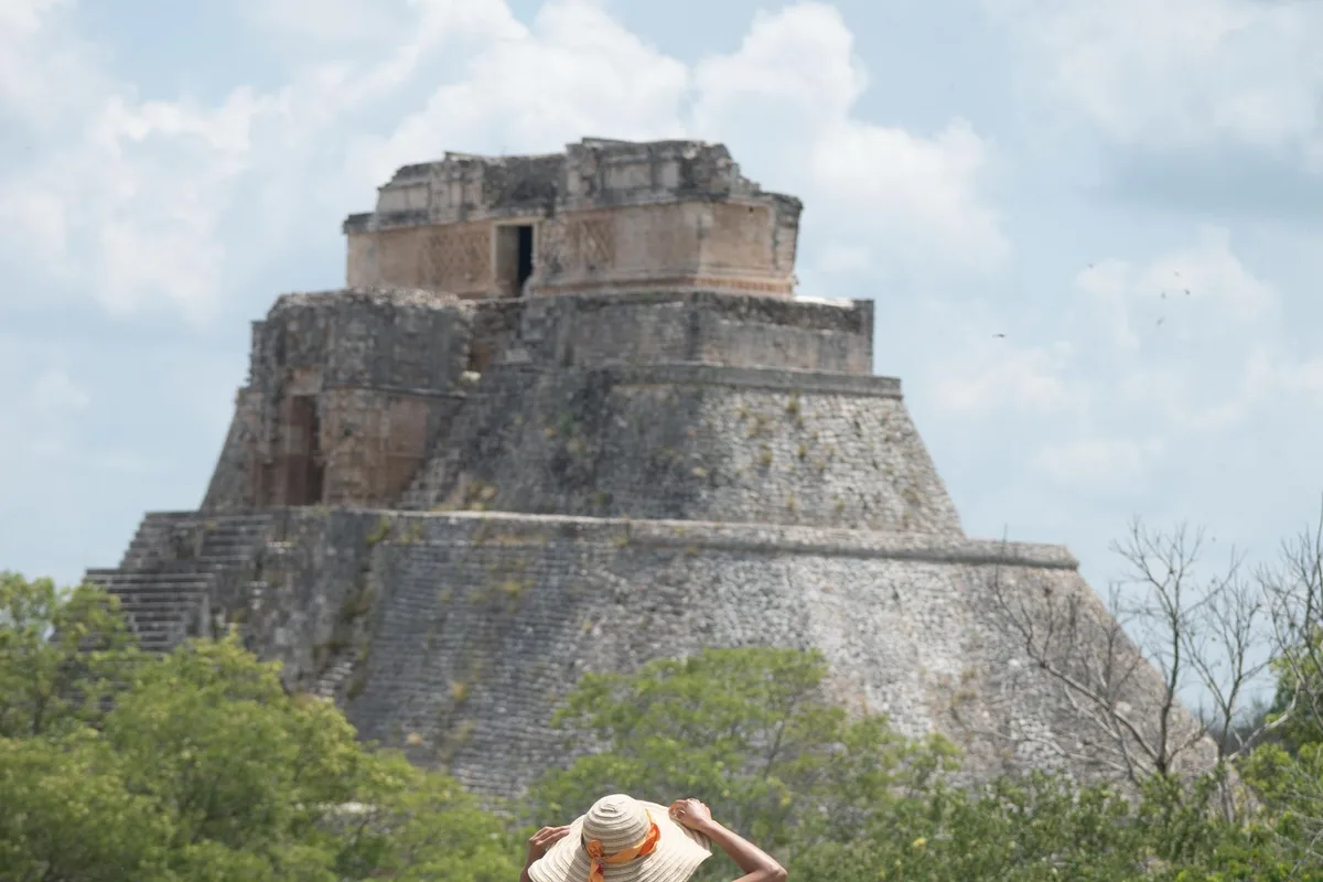 The Pyramid of the Magician rising over the lawns at Uxmal