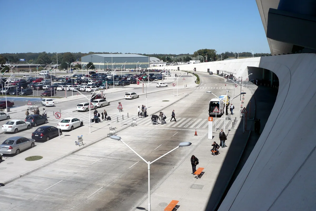 The drop-off road and curved white roof of Carrasco International Airport