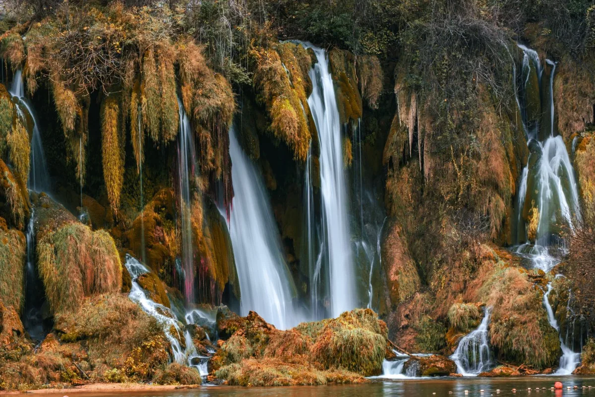 The tufa cascades of the Kravica Waterfalls pouring into the swimming basin