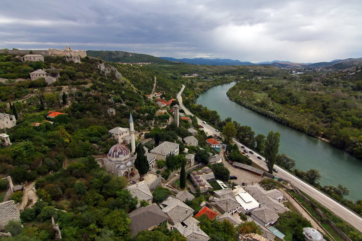 Počitelj from above, the stone village and its fortress on the bend of the Neretva