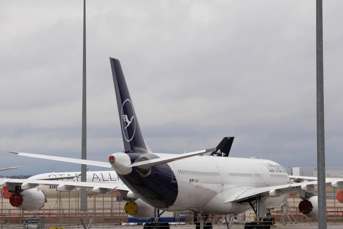 A Lufthansa jet parked at the gate at Munich Airport