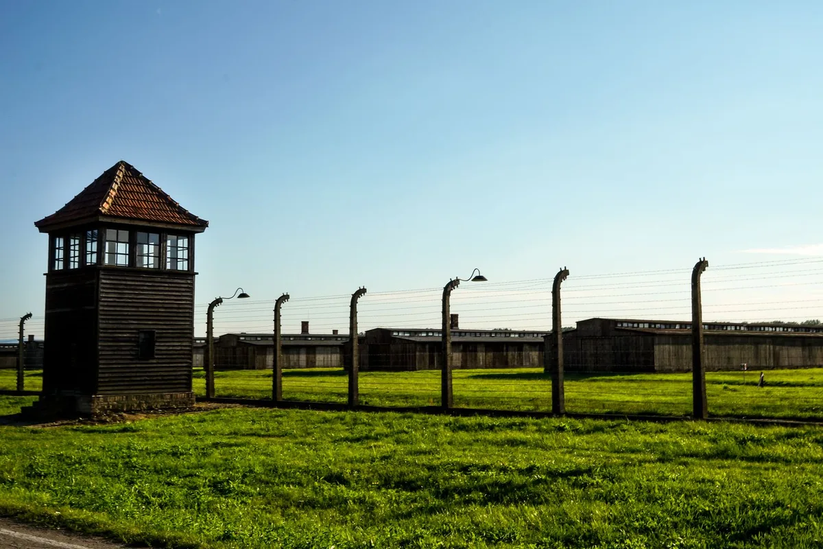 The watchtower and fence line at the Dachau Concentration Camp Memorial Site