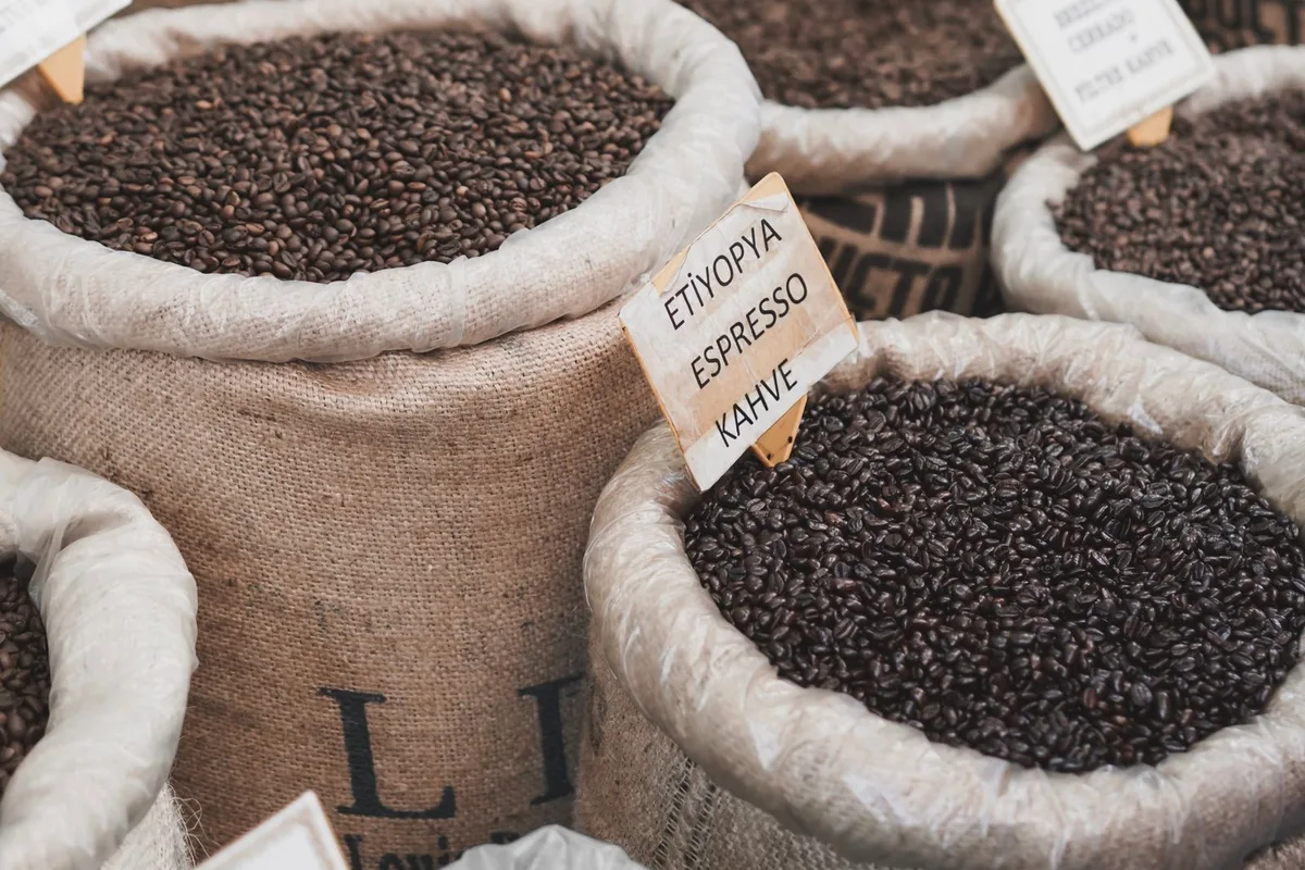 Sacks of Kenyan coffee beans at a Nairobi market stall