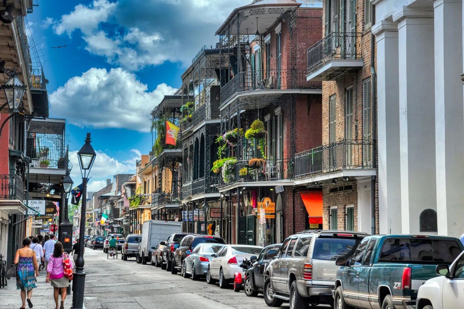 Cast-iron balconies and colorful facades on a French Quarter street