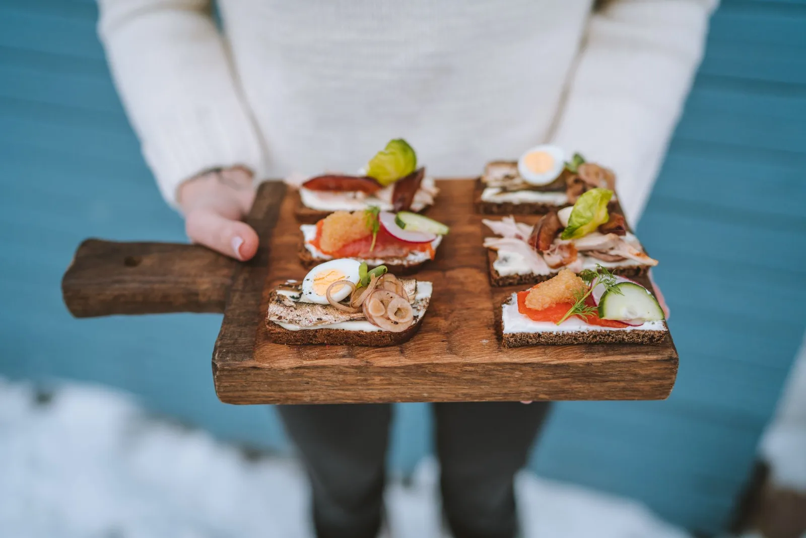 Open sandwiches on a wooden board
