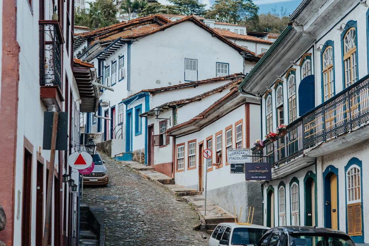 A steep cobbled lane between colonial houses in Ouro Preto