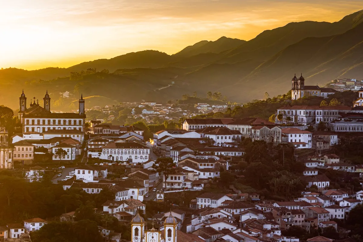 Ouro Preto at sunset, church towers above the rooftops