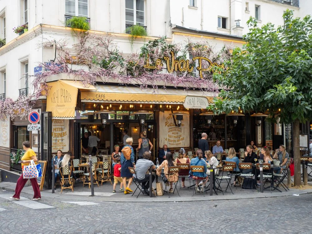 French café awnings and street signs in Paris