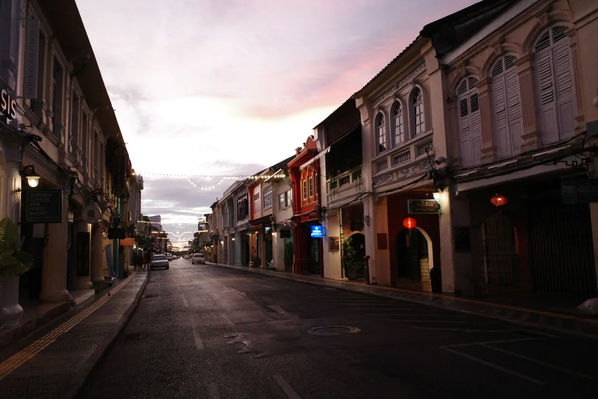 Sino-Portuguese shophouses on a Phuket Old Town street at dusk