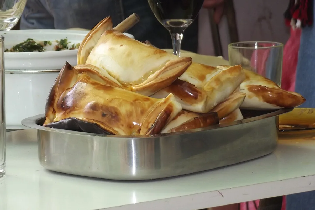 Empanadas de pino, Chile's baked beef empanadas, on a serving tray