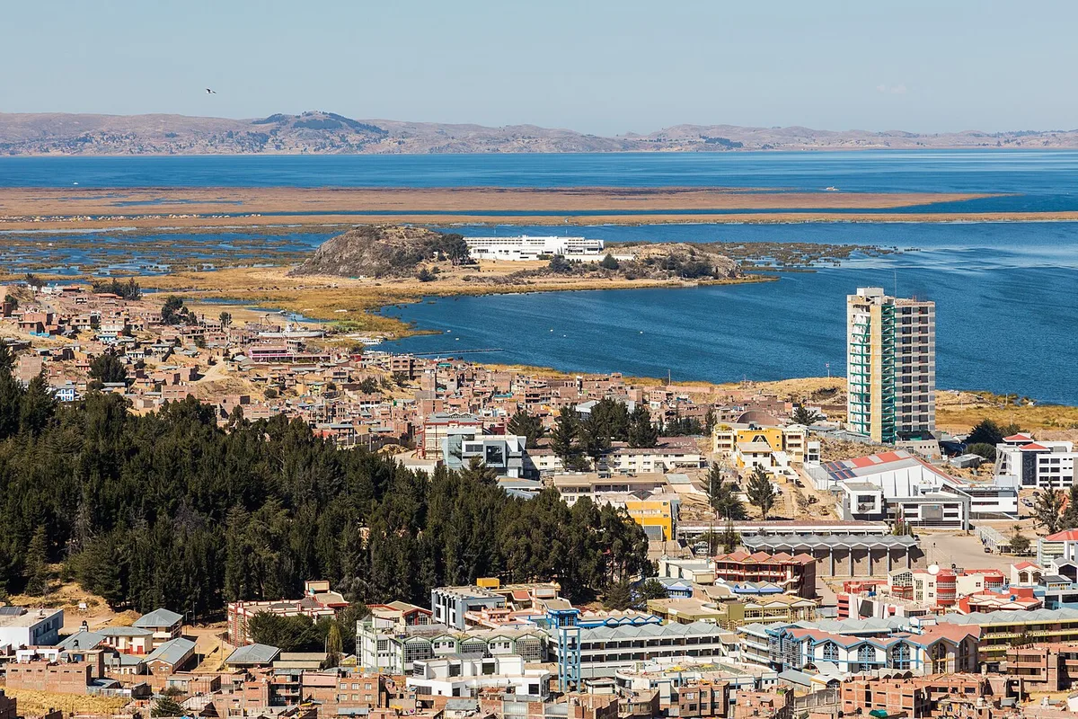 Puno spread along the shore of its bay on Lake Titicaca, with Esteves Island offshore