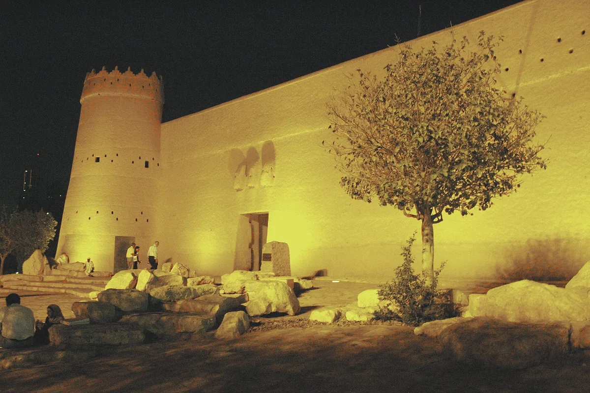 Al Masmak Fortress in old Riyadh, its mud-brick walls and round tower floodlit at night