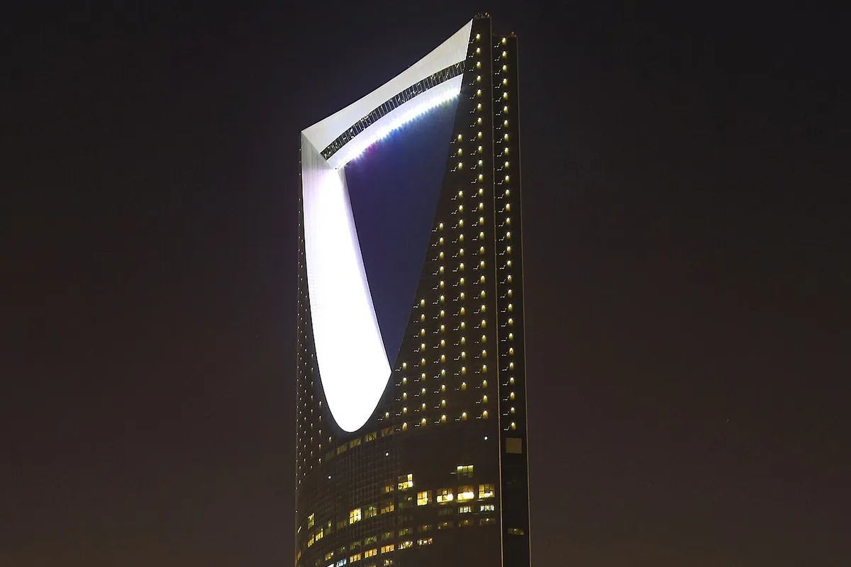 The Kingdom Centre tower lit against the night sky in Riyadh