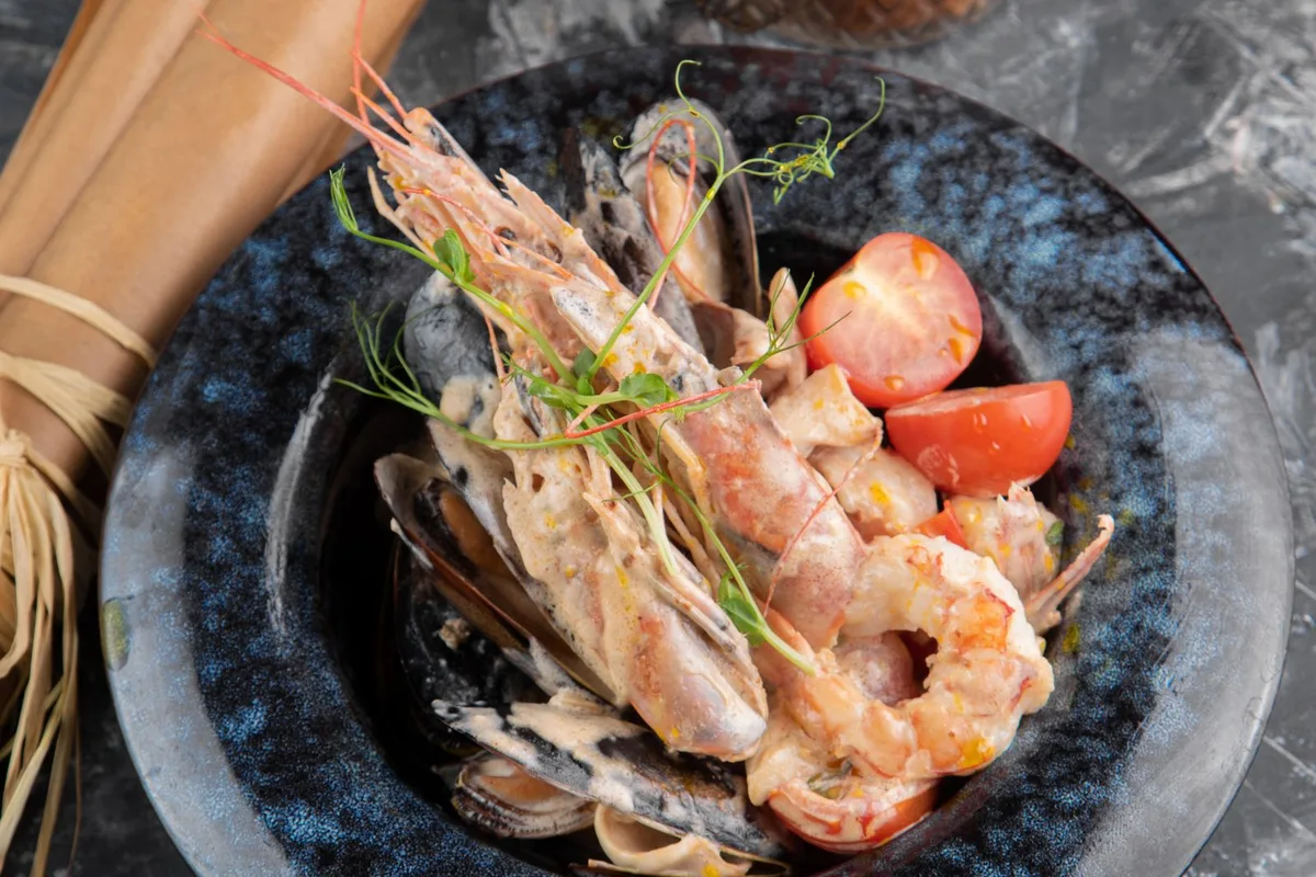 A plate of garlic shrimp with rice, served island style
