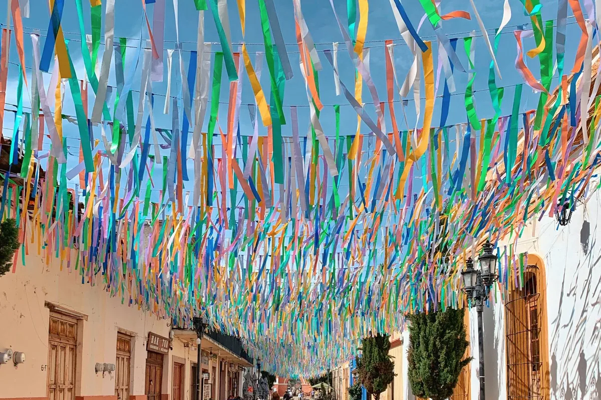 Colourful ribbons strung above a colonial street in San Cristóbal de las Casas