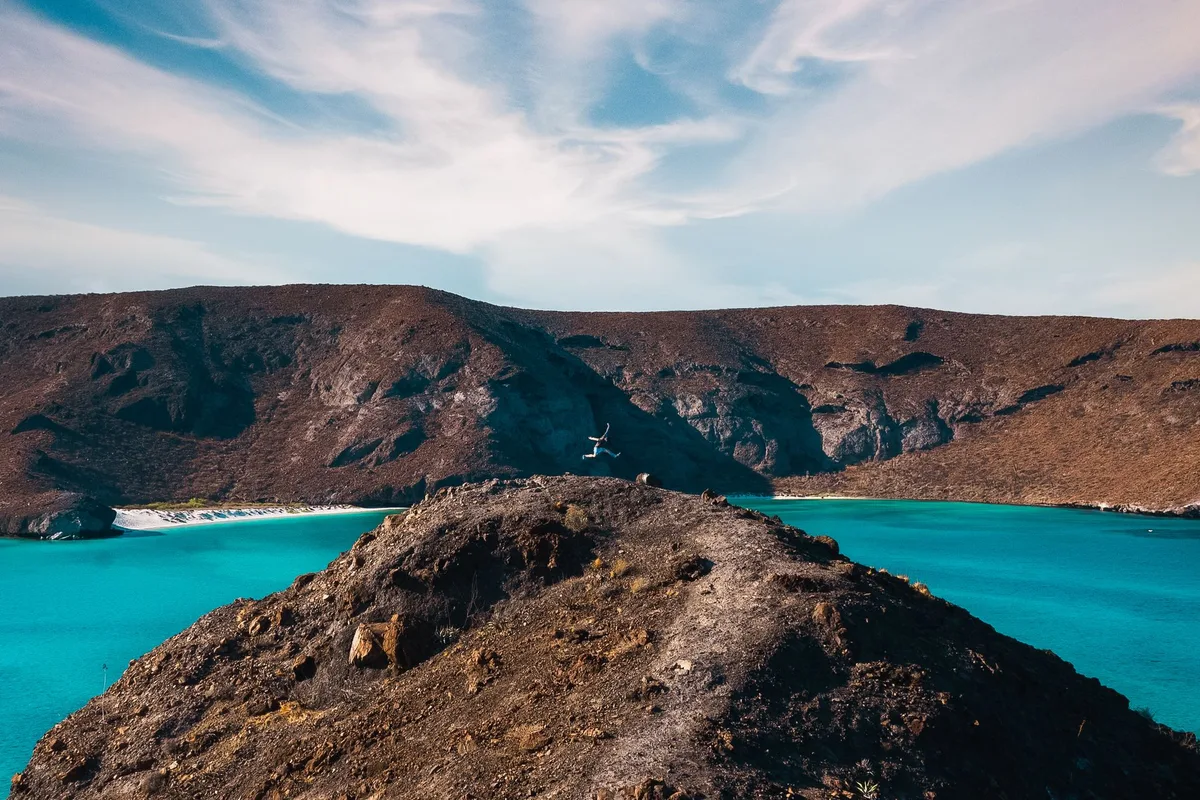 Balandra Bay near La Paz, its turquoise shallows under arid red hills