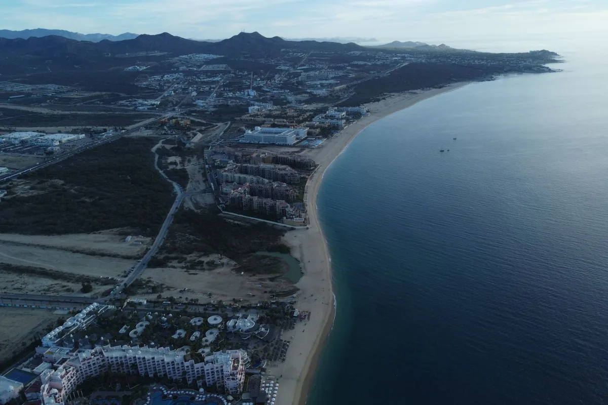 The sweep of San José del Cabo's hotel-zone beach and bay from the air at dusk