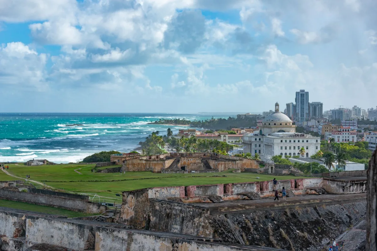 Castillo San Cristóbal, the city wall and the Capitol dome above the Atlantic in Old San Juan