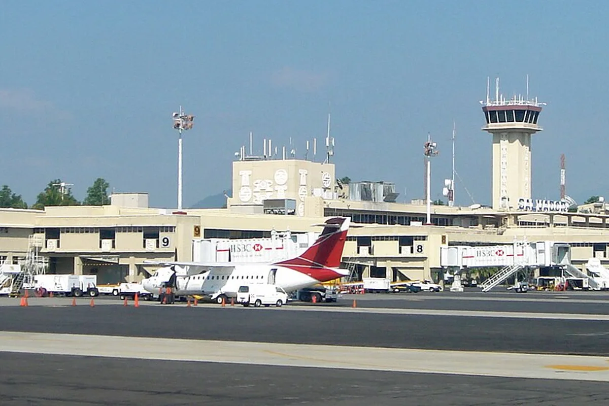 The terminal and control tower at El Salvador International Airport, Comalapa, aircraft parked at the gates