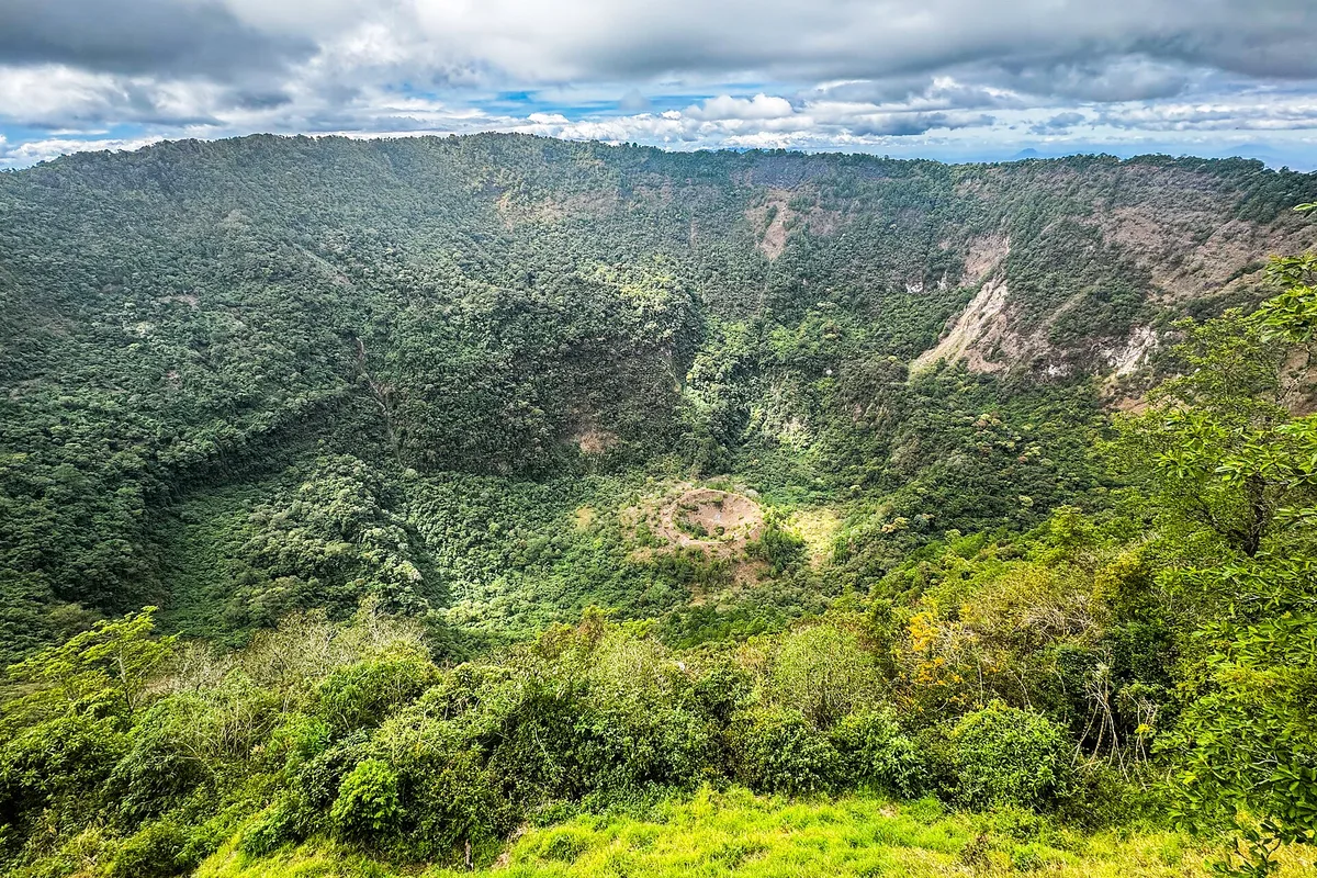 The green crater of El Boquerón on the San Salvador volcano, forest inside the rim