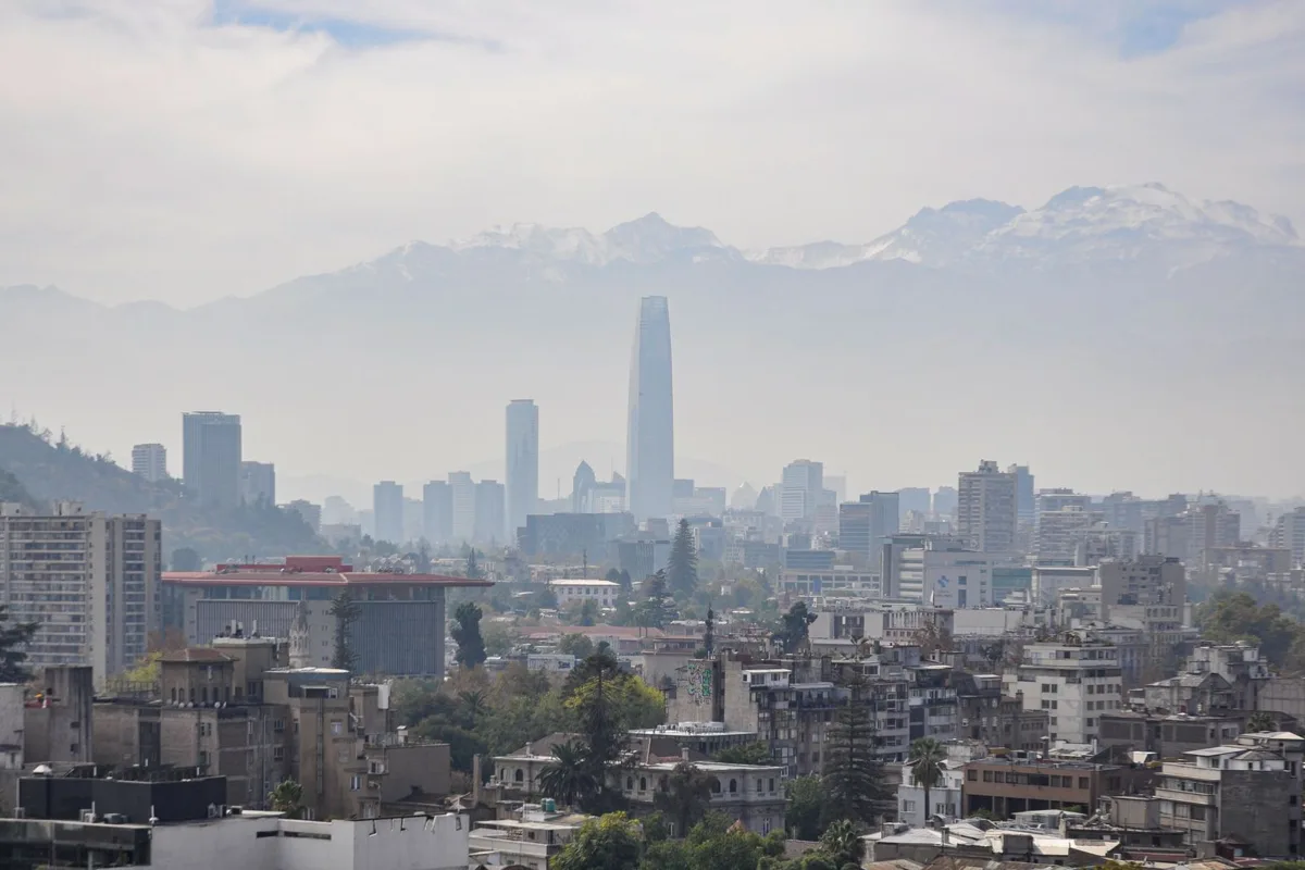 Santiago skyline and the Costanera Center tower below the snow-capped Andes