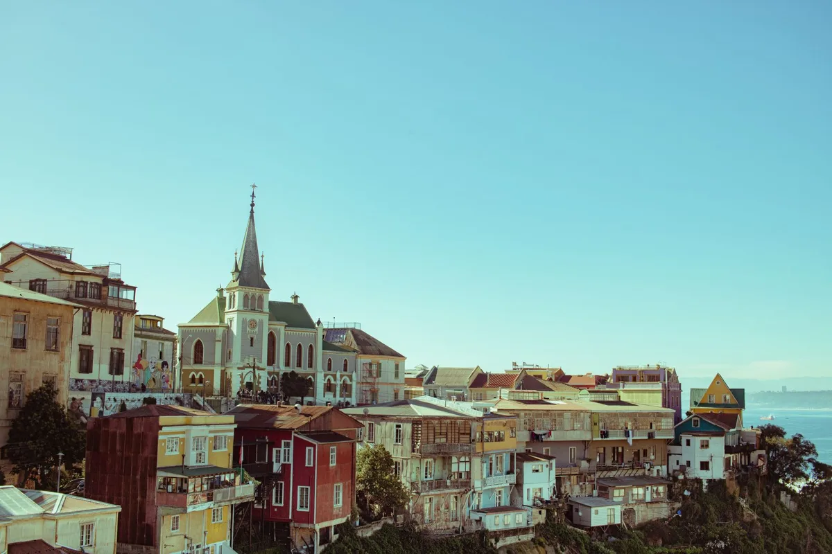 Colourful houses and a church on a Valparaiso hill above the port