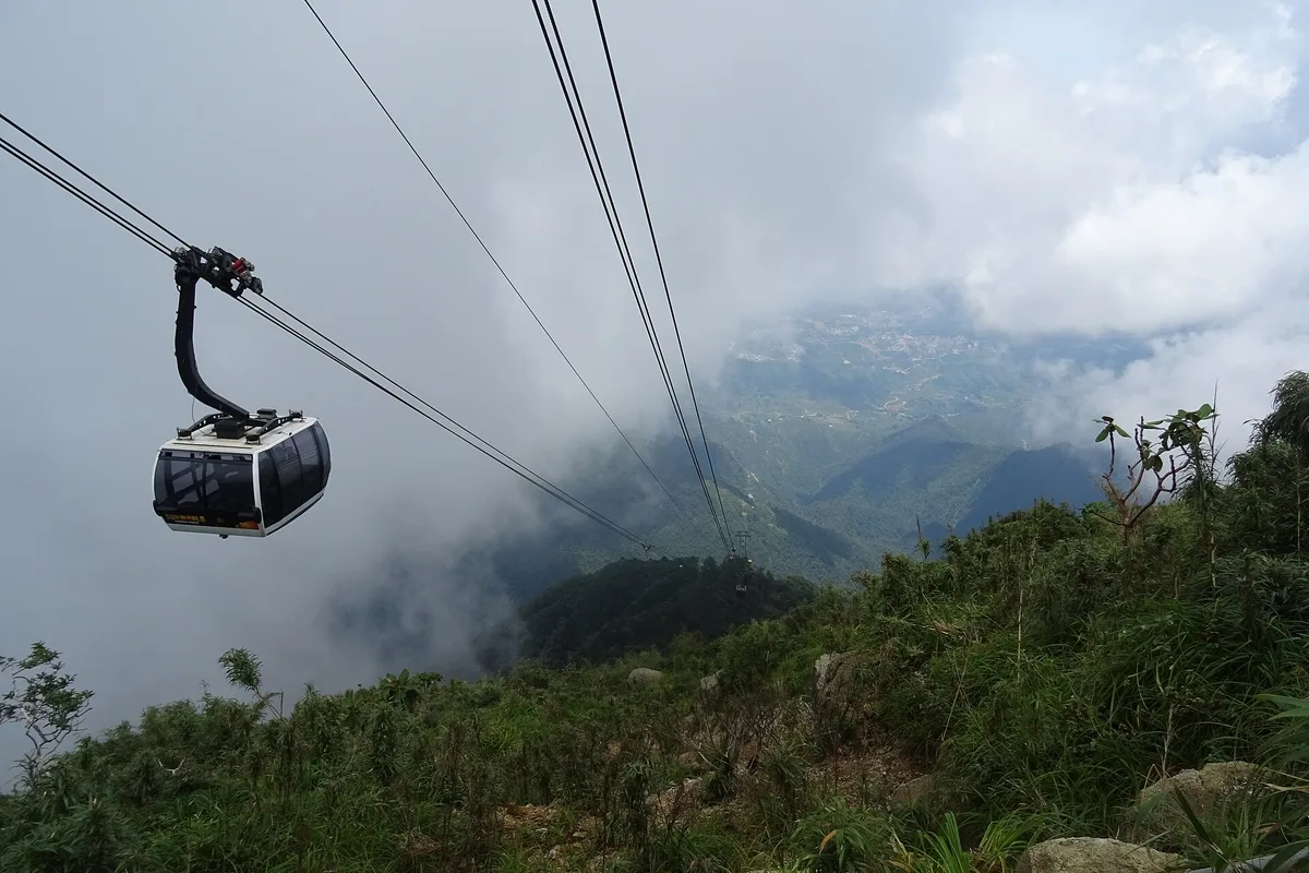 A Fansipan cable car cabin crossing the cloud above the Sapa mountains