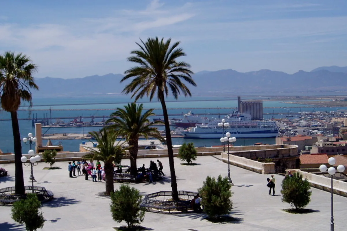 The Bastione di Saint Remy terrace in Cagliari, palms above the port and the Gulf of Cagliari