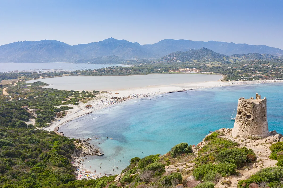 The tower and turquoise bay of Porto Giunco beach near Villasimius, south Sardinia