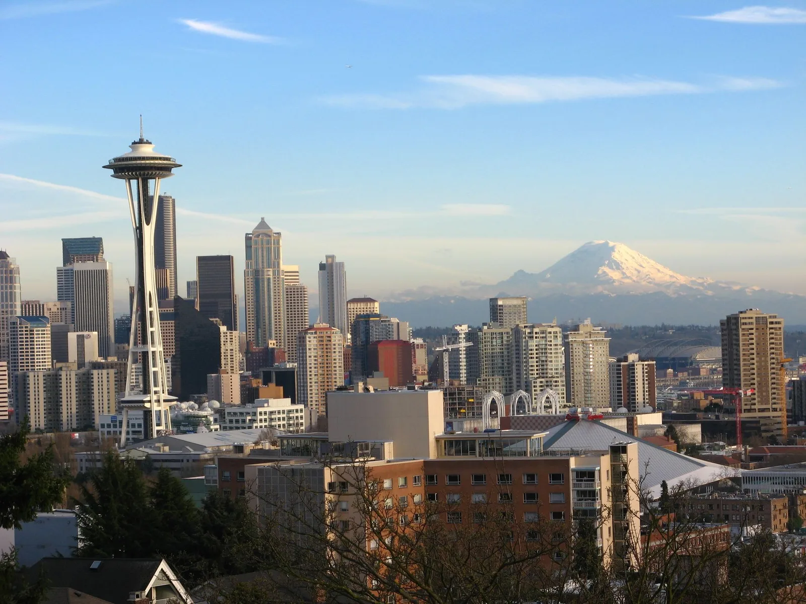 The Space Needle and downtown Seattle with snow-capped Mount Rainier behind