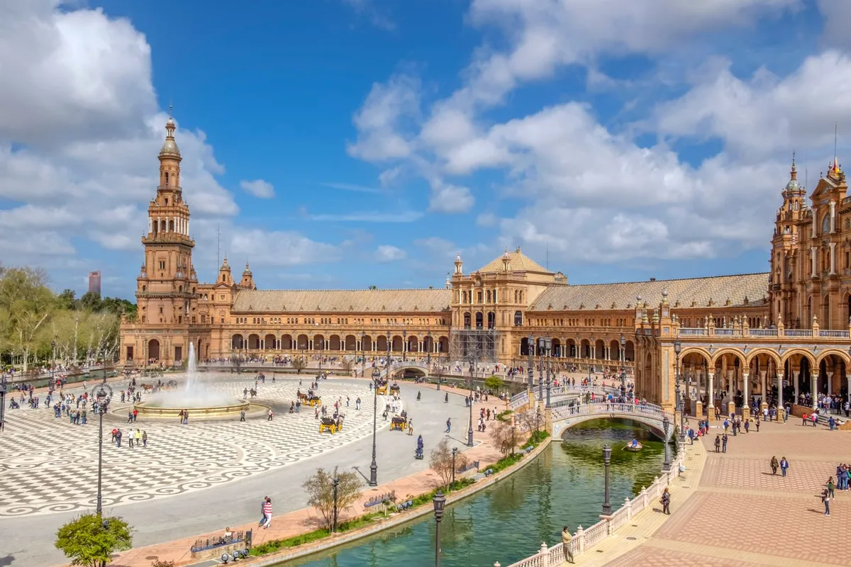 The Plaza de España in Seville, its canal, bridges and towers in morning light