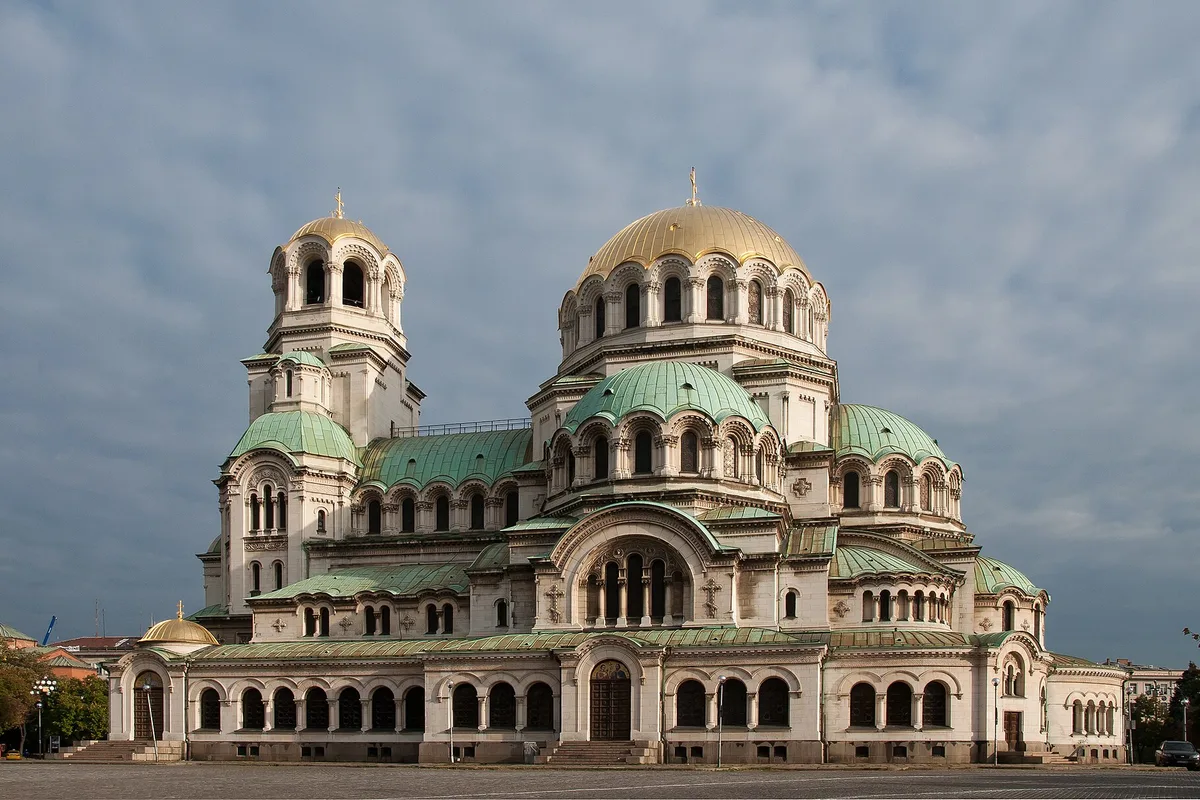The Alexander Nevsky Cathedral in Sofia, green and gold domes above the empty plaza