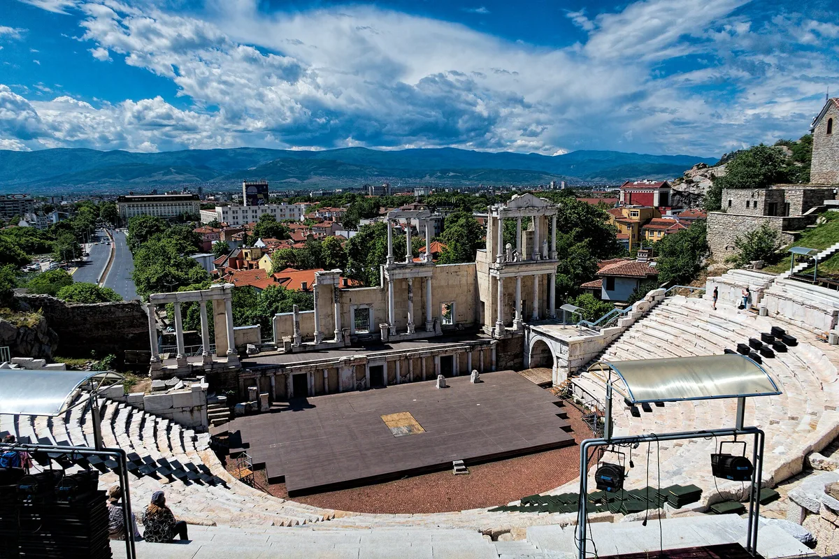 The ancient Roman Theatre in Plovdiv's old town, with the city spread beyond