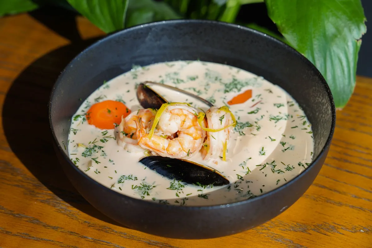A bowl of seafood chowder with shrimp and mussels, served St. Augustine style