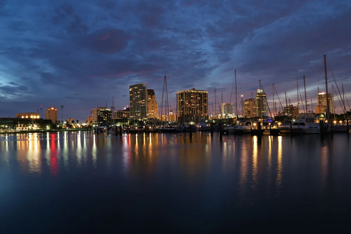 Downtown St. Petersburg, Florida at dusk, lights reflecting on the marina water