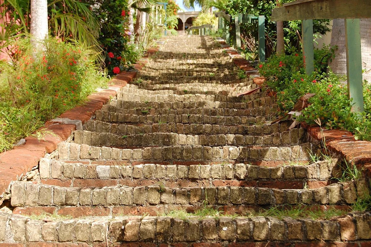 The 99 Steps in Charlotte Amalie, a brick and stone staircase climbing between gardens
