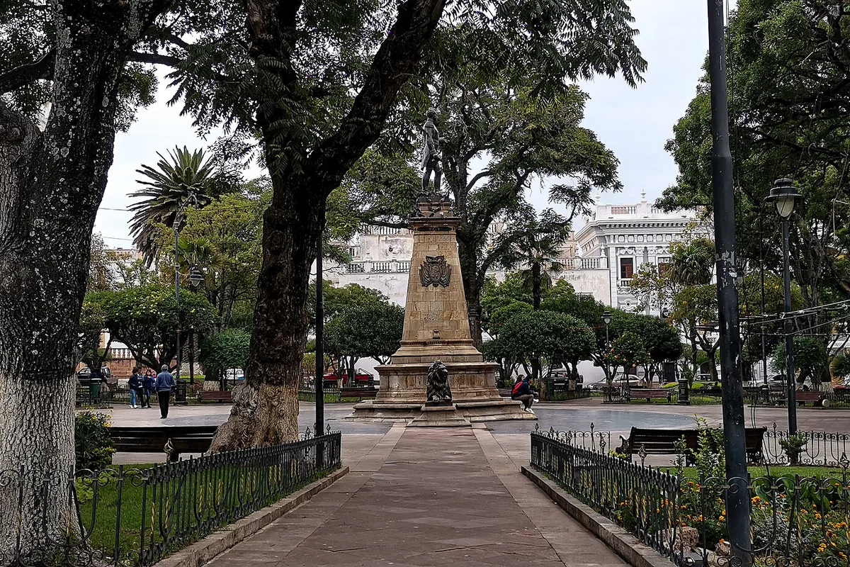Plaza 25 de Mayo in Sucre, gardens and monument under the trees