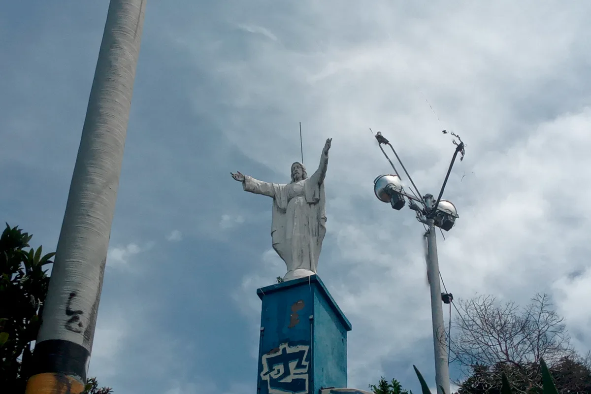 The Cristo del Picacho above Tegucigalpa, arms open against a bright sky