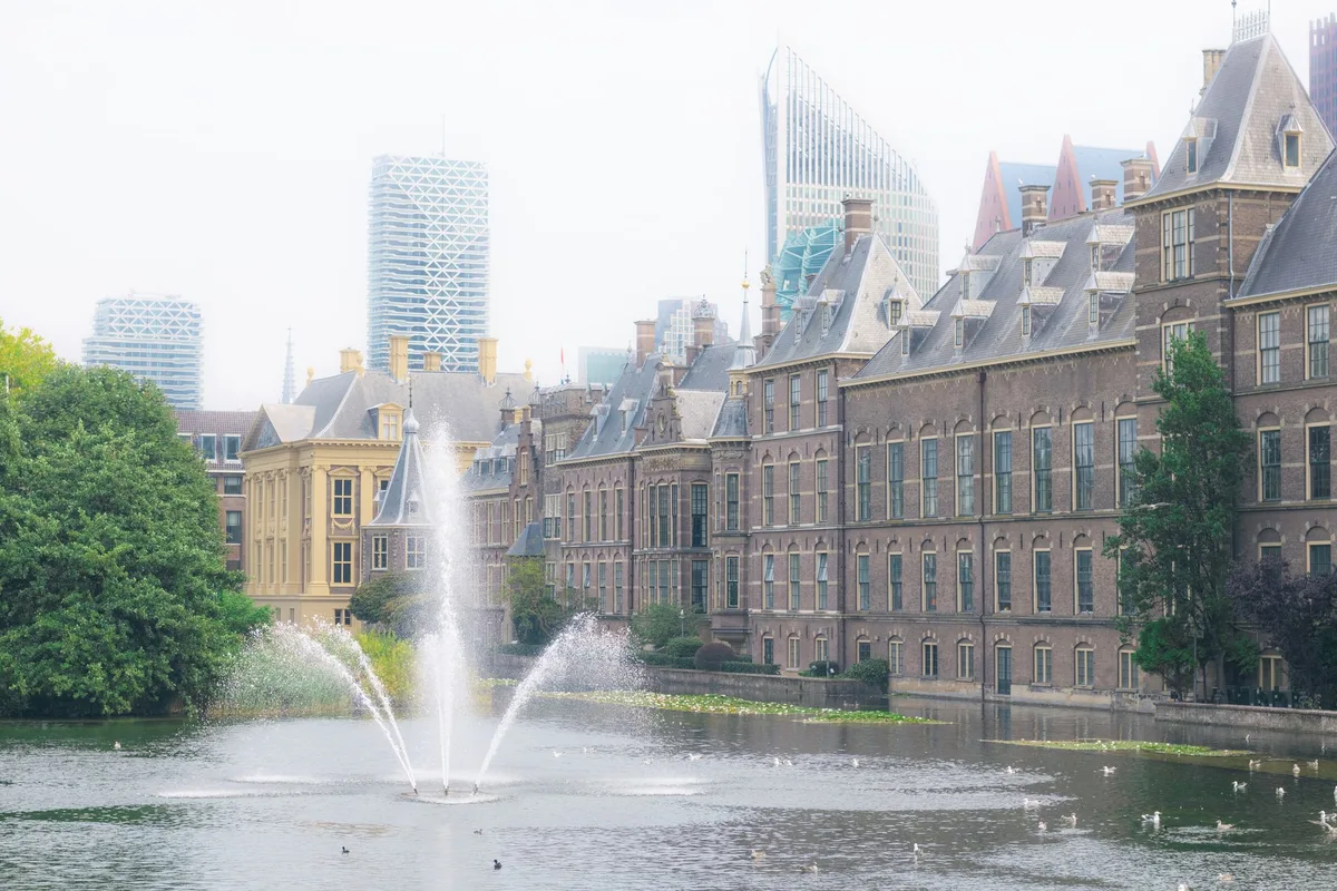 The Binnenhof across the Hofvijver pond with The Hague skyline behind
