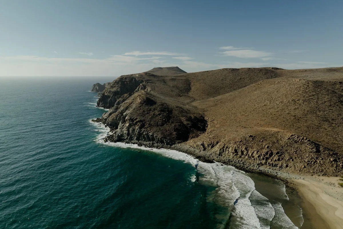 The Pacific coast of Baja California Sur, desert headlands above a turquoise bay