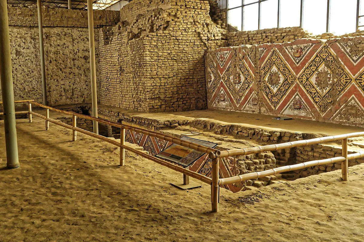 Polychrome reliefs in red, white and black inside Huaca de la Luna, the Moche Moon temple