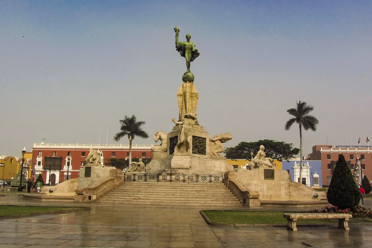 The Liberty monument on Trujillo's Plaza de Armas, with the Cathedral and colonial mansions behind