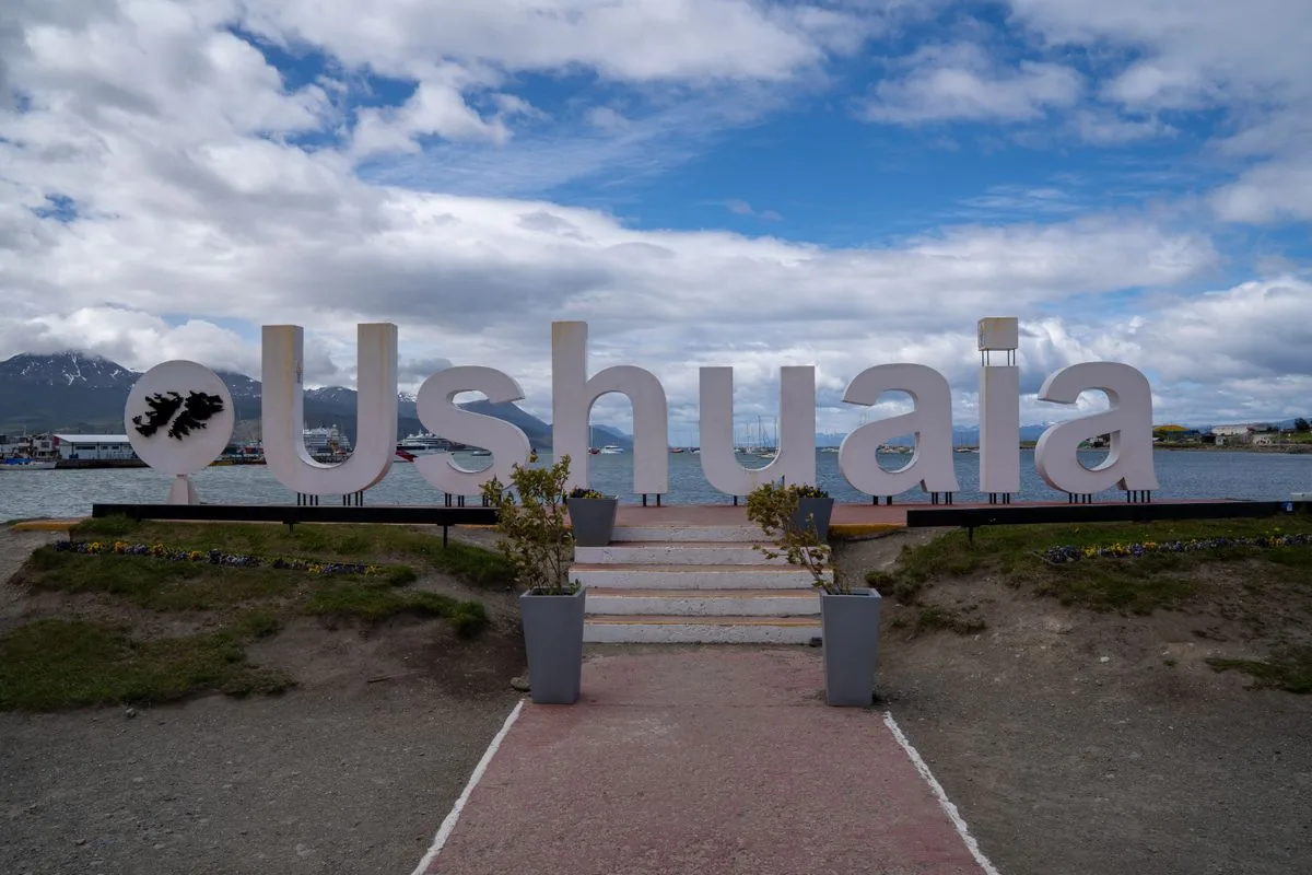 The big Ushuaia sign on the waterfront, the Beagle Channel behind it