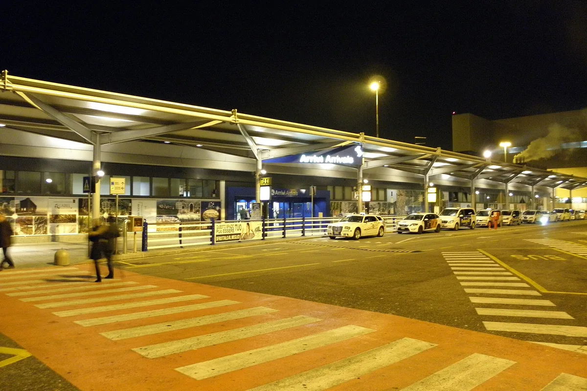 Verona Villafranca Airport arrivals at night, the taxi rank under the canopy outside Terminal 2
