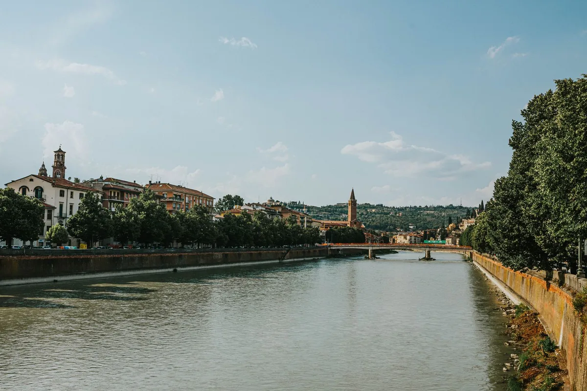 The Adige river bending through Verona, church towers on the far bank