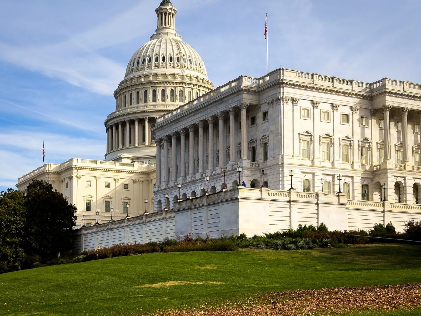 The US Capitol in warm late light above its lawn