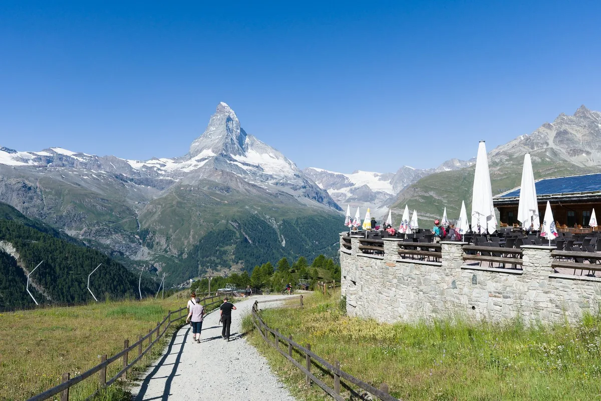 A mountain café terrace with a Matterhorn view